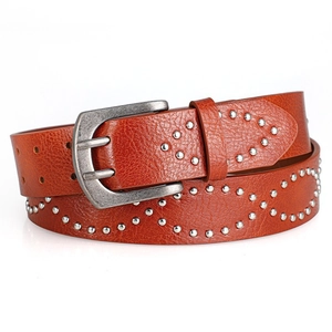Detailed close-up of brown leather belt with silver rivets and vintage buckle