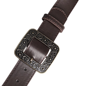 Detailed close-up of dark brown faux leather belt with vintage floral engraved metal buckle