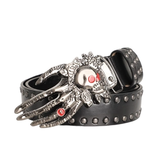 Detailed view of punk leather belt with silver rivets and skull hand metal buckle