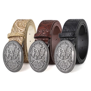 Cinture western retrò con fibbie intagliate e pelle goffrata in nero, marrone e beige