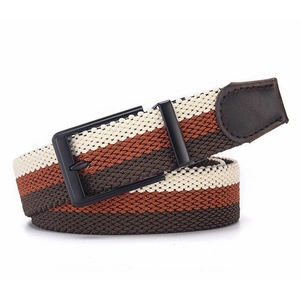 Detail of tricolor braided elastic belt with matte black buckle and leather end cap