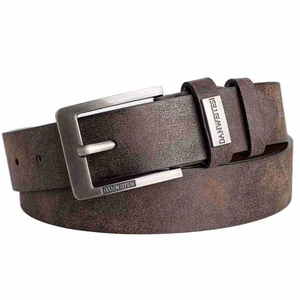 Detail of vintage dark brown belt featuring a gunmetal pin buckle and matte texture