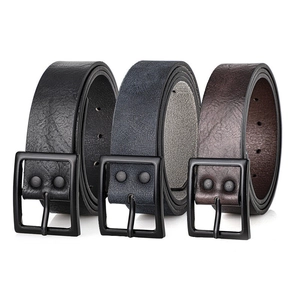Detailed view of three vintage PU leather belts in black, grey, and brown with matte buckles