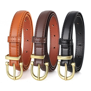 Three classic minimalist leather belts for women in black and brown with golden D-rings