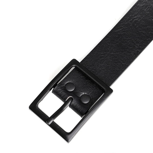 Detail view of a black faux leather belt featuring a matte square metal prong buckle