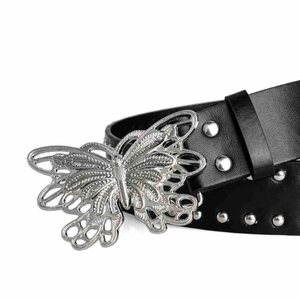 Detail of black leather belt featuring an ornate silver butterfly buckle and metal rivets