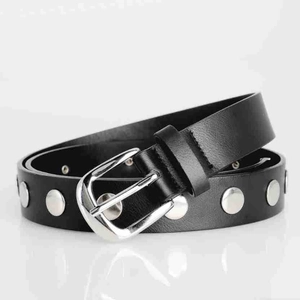 Detail view of black vintage punk belt featuring silver metal rivets and a classic pin buckle