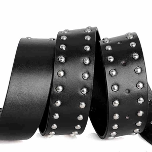 Detailed view of black leather belt featuring double rows of polished silver metal studs