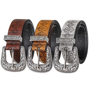 Vintage western cowboy belts with embossed leather and baroque engraved metal buckles