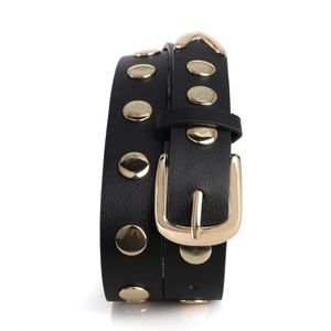 Close-up of black leather punk belt featuring double rows of gold metal rivets and a square buckle