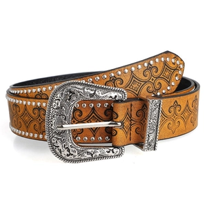 Detail of western belt with silver metal studs and floral engraved buckle on leather