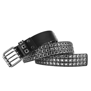Close-up of punk rock leather belt with three rows of silver square metal rivets