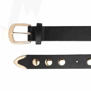 Detailed close-up of punk black leather belt with golden buckles and metal eyelets
