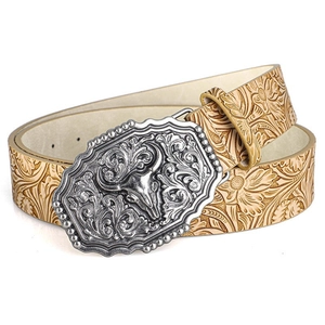 Close-up of western leather belt featuring a bull head buckle and floral embossing