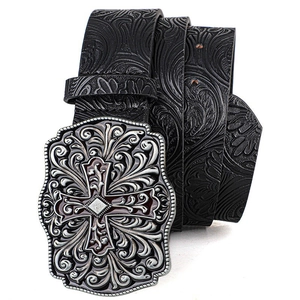 Detail of vintage silver belt buckle with cross carving and embossed floral leather strap