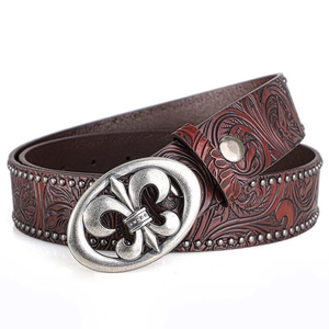 Ceinture punk vintage en cuir embossé avec boucle fleur de lys et clous métalliques