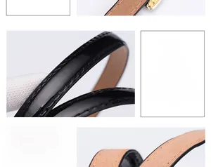 Detail showing the glossy patent leather texture and neat stitching of the skinny belt