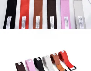 Detailed collection of colorful canvas belts with black metal buckles and leather tips