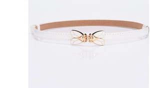 Macro shot of white leather skinny belt featuring an elegant gold butterfly buckle design
