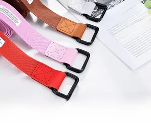 Detail of woven canvas belts in four colors with matte black square double buckles
