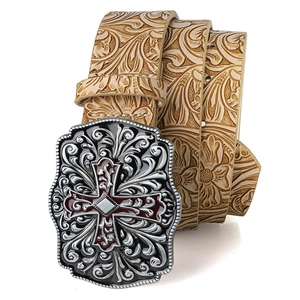 Detail of western beige leather belt with floral embossing and silver cross buckle