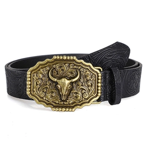 Detailed relief of bull head buckle on vintage Western embossed leather belt