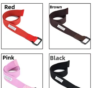 Canvas belts in red, brown, pink, and black with D-ring buckles and fabric labels