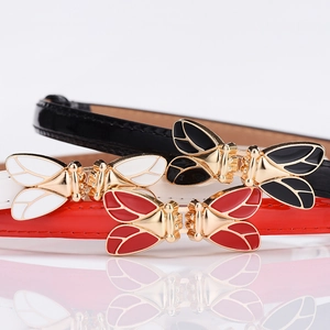 Slim women's fashion belts in black, white, and red with gold bee flower buckles