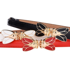 Three-piece set of slim fashion belts with golden bee buckles in black, white, and red