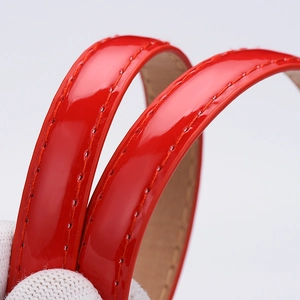 Glossy red patent leather belt with fine stitching for women's dress accessories