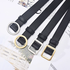 Set of four black faux leather belts with gold and silver round and square buckles