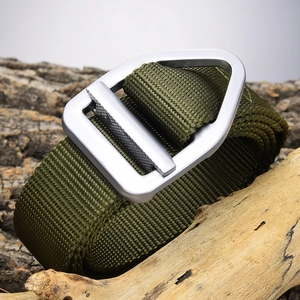 Tactical nylon belt in olive green with matte metal alloy buckle on wooden background