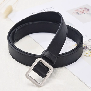 Minimalist black leather belt for women with a classic square silver metal buckle on white