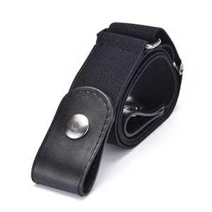 Detail view of black elastic belt with silver metal buckle and faux leather ends