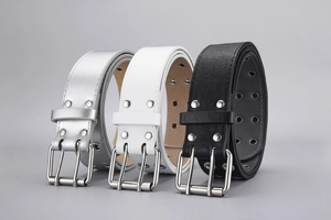Three punk style belts with double grommets in silver, white, and black colors