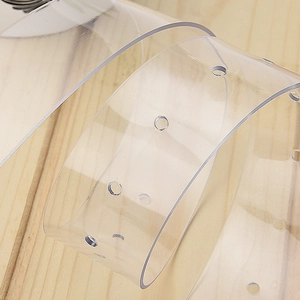 Minimalist transparent heart PVC belt for women on natural wooden background