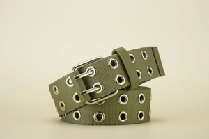 Macro shot of olive green canvas belt with double grommets and silver double-pin buckle