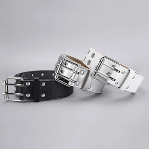 Three punk style double grommet belts in black, silver and white with dual pin buckles