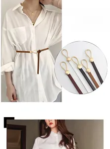 Detailed view of slim leather waist belts with elegant gold buckle in multiple colors