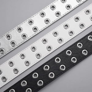 Punk style double grommet belts in black, white, and silver faux leather with metal buckles