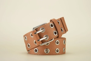 Detail of khaki canvas belt with silver metal grommets and square needle buckle closure