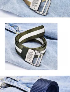 Detailed close-up of double D-ring metal buckles on striped canvas belts for trousers