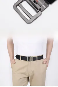 Detail of canvas belt double ring buckle and male model wearing it on khaki pants