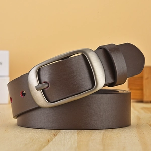 Detail view of dark brown belt with litchi texture and vintage matte metal buckle