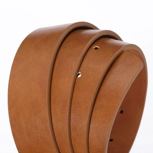 Close-up of brown leather belt showing smooth edges and detailed texture in a roll