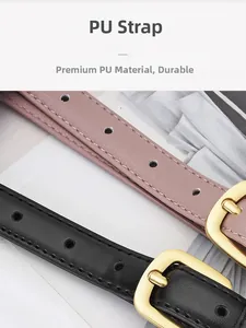 Détail de fines ceintures en cuir PU noir et rose avec boucles ardillon dorées