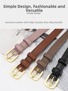 Détail de quatre ceintures fines en cuir rose, marron et noir avec boucles dorées en alliage de zinc