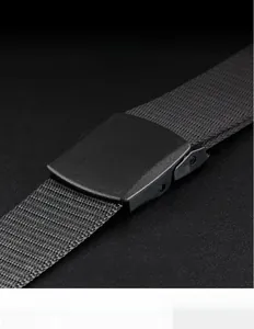 Detail of black nylon web belt with matte buckle showing no-hole stepless adjustment design