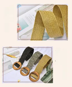 Close-up of woven straw elastic belts with round wooden buckles in khaki and black colors