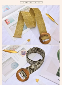 Close-up of woven stretch belt textures with decorative round wooden buckle details